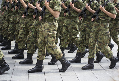 Low section of soldiers marching on street