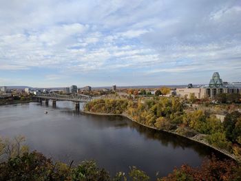 River in town against sky