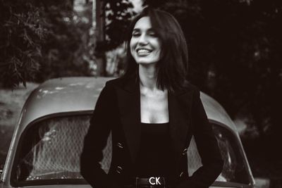 Portrait of a smiling young woman in car