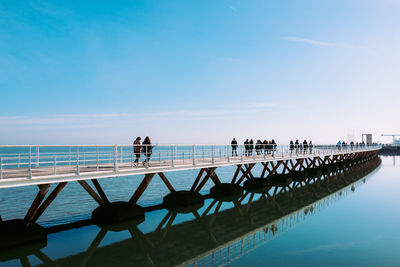 Scenic view of sea against clear blue sky