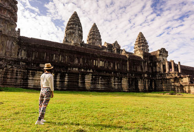 Woman standing outside temple