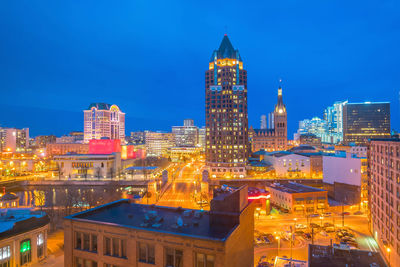 Illuminated buildings in city at night