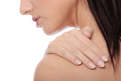 Close-up of woman with hand on white background