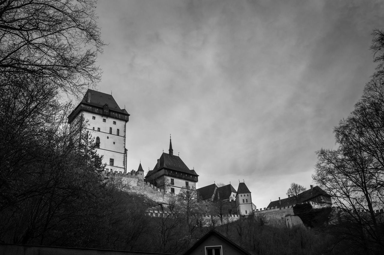 architecture, building exterior, built structure, house, sky, church, residential structure, tree, residential building, place of worship, religion, cloud - sky, roof, spirituality, low angle view, outdoors, cloudy, building