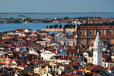 High angle view of residential district by river