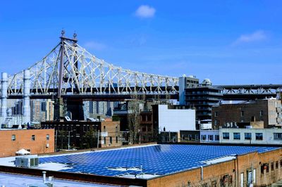 Low angle view of buildings against blue sky