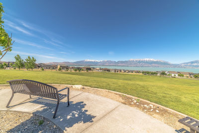 Scenic view of field against blue sky