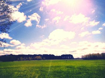 Scenic view of cloudy sky over field