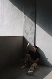 Low section of woman sitting on steps