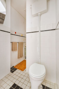 Low section of woman standing in bathroom