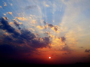 Low angle view of dramatic sky during sunset