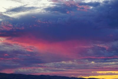 Low angle view of dramatic sky during sunset