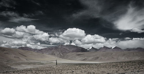 Scenic view of landscape and mountains against sky