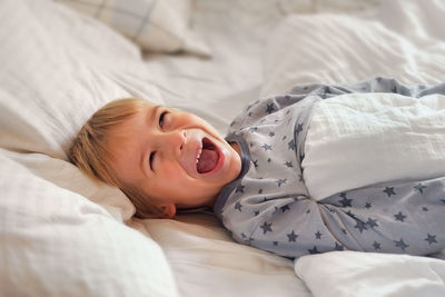 Young woman sleeping on bed at home