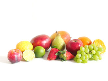 Close-up of fruits on white background