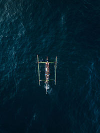 Aerial view of outrigger in sea