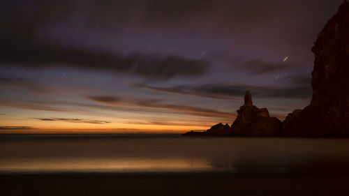 Scenic view of sea against sky at sunset