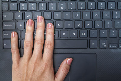 Close-up of hand using mobile phone