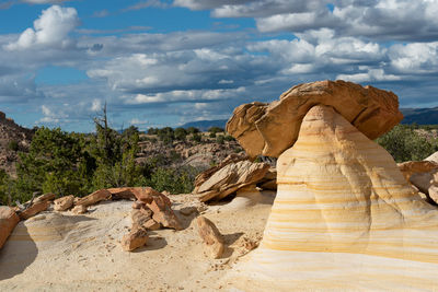 Landscape of large yellow striped conical rock formation at ojito wilderness in new mexico