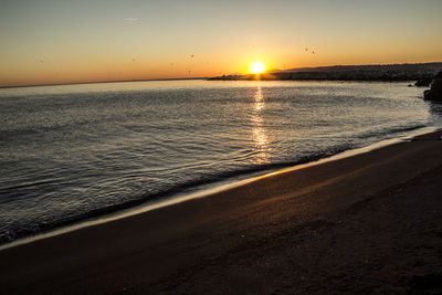 Scenic view of sea against sky during sunset