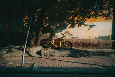 Bicycle parked on street in city