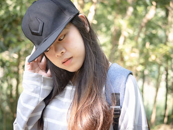 Portrait of teenage girl wearing hat