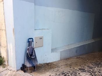 Man leaning against wall