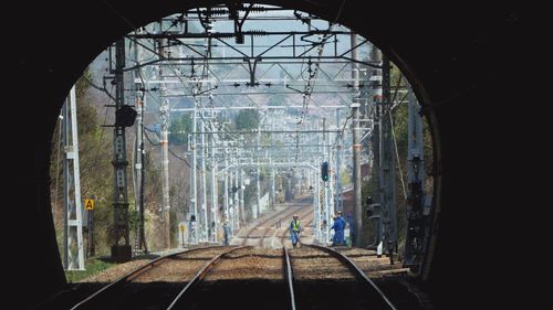 Digital composite image of railroad tracks in tunnel
