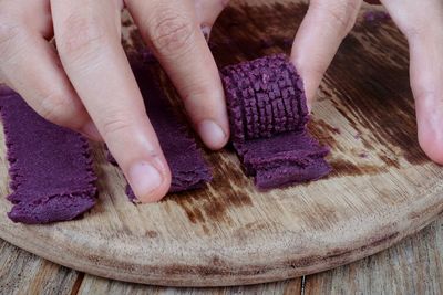 Close-up of hands preparing food