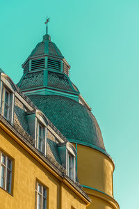 Low angle view of building against clear blue sky