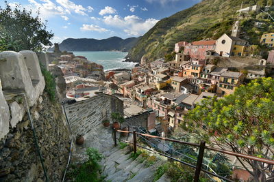 High angle view of townscape by sea
