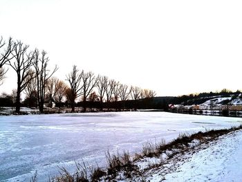 Scenic view of winter landscape against clear sky