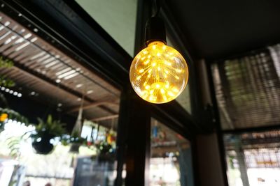 Low angle view of illuminated light bulb