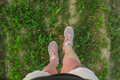 Low section of man standing on ground