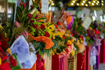 Multi colored flowers for sale at market stall