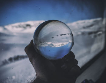 Close-up of hand holding ice cream