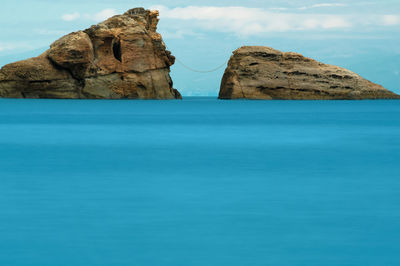 Long-exposure of two large rocks named ushitsuki-iwa on coast of japan.