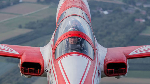 Close-up of red airplane at airport