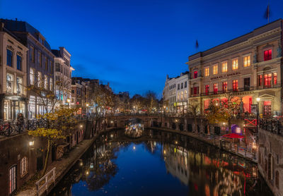 Reflection of illuminated buildings in canal at night
