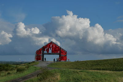 House on field against sky