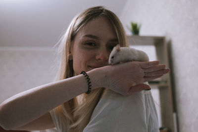 Portrait of woman with teddy bear