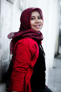 Portrait of a smiling young woman in winter