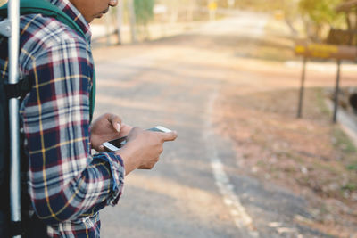 Close-up of man using smart phone