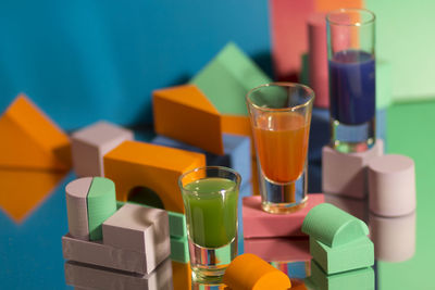 Close-up of multi colored glass on table