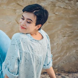 High angle view of woman looking away while standing on land