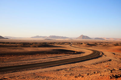 Scenic view of desert against clear sky