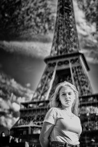 Portrait of woman with tower in background