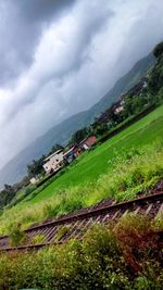 Scenic view of landscape against cloudy sky