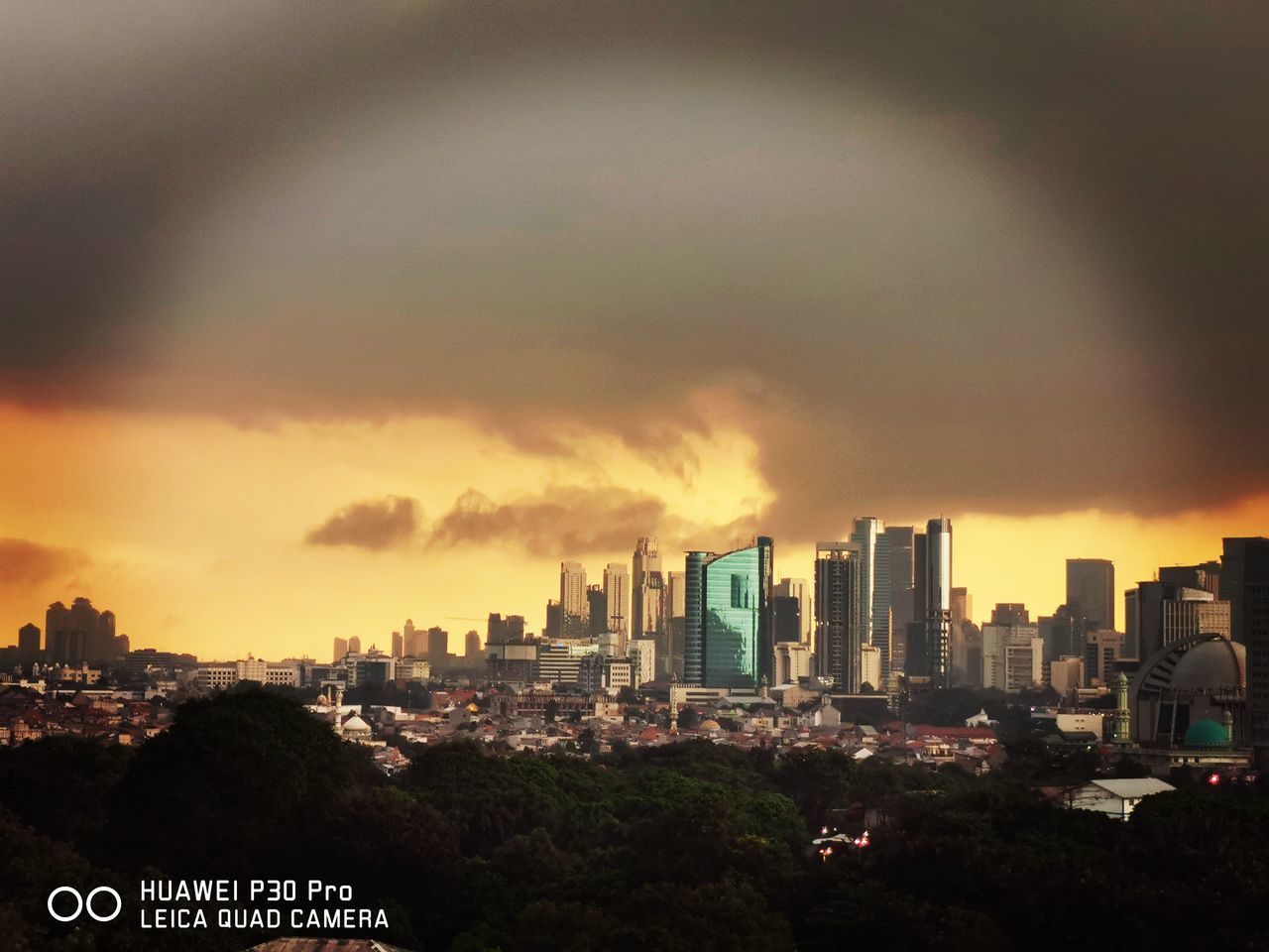 MODERN BUILDINGS AGAINST SKY DURING SUNSET