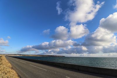 Scenic view of sea against blue sky